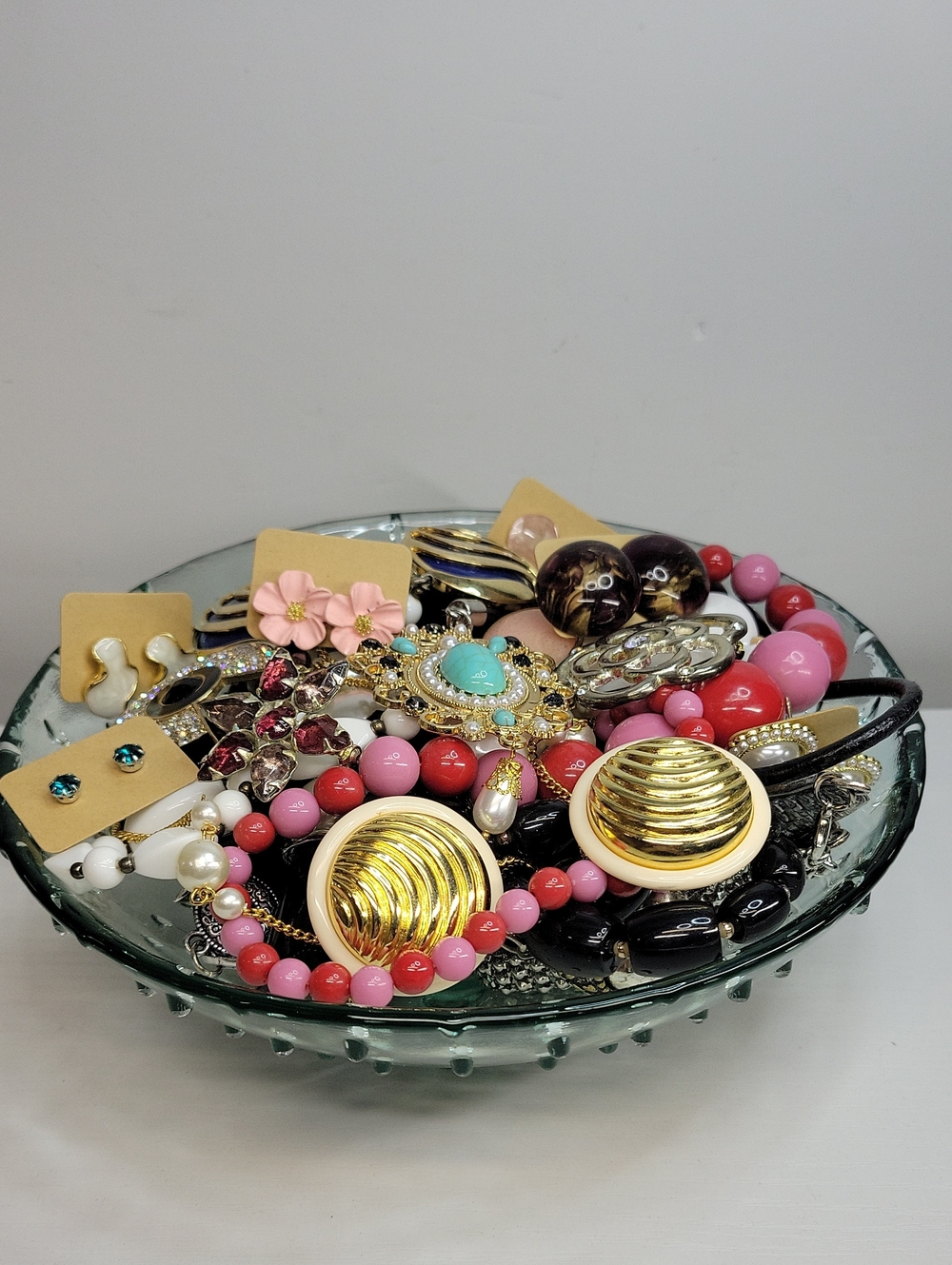 Assorted Jewelry In A Glass Dish